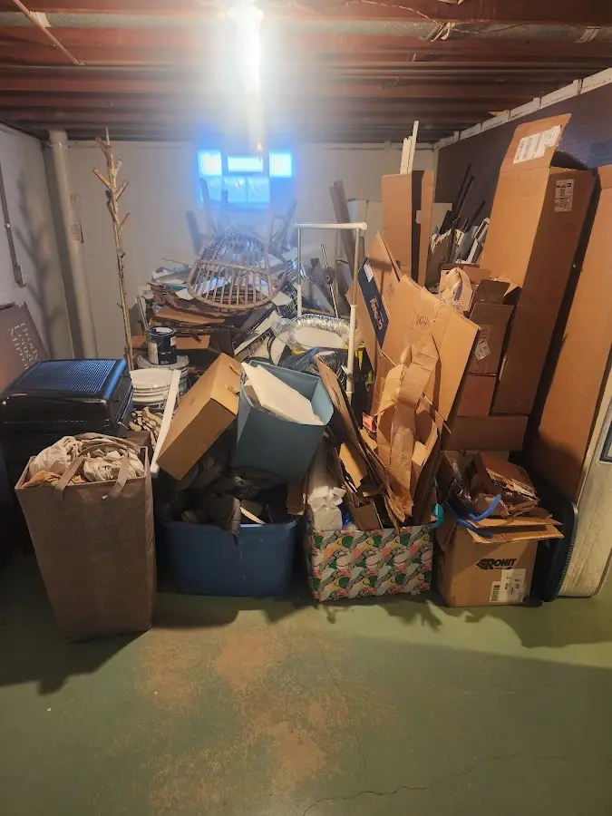 Roll-off dumpster container at job site for 6 Yard Dumpster Rental in Casco